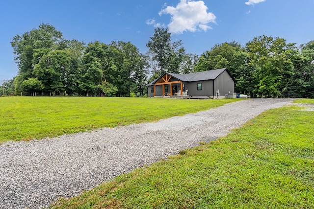 1567 Oak Knob Rd, Lafayette, TN 37083 - view of green lawn with driveway and a porch