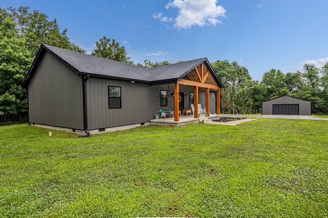 1567 Oak Knob Rd, Lafayette, TN 37083 - back of house with a detached garage, a lawn, an outdoor structure, and a patio area