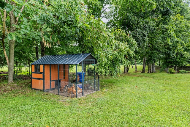 1567 Oak Knob Rd, Lafayette, TN 37083 - view of green lawn featuring exterior structure and an outbuilding