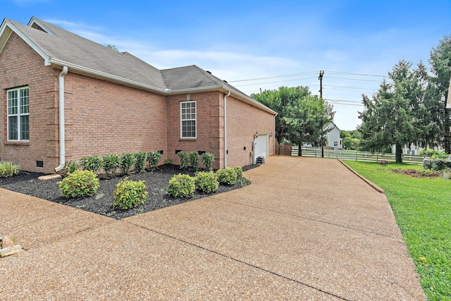 1729 Dryden Dr, Spring Hill, TN 37174 - view of side of home featuring brick siding, crawl space, and a shingled roof