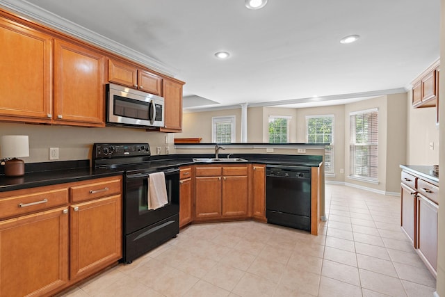 1729 Dryden Dr, Spring Hill, TN 37174 - kitchen with black appliances, a peninsula, brown cabinets, recessed lighting, and light tile patterned flooring