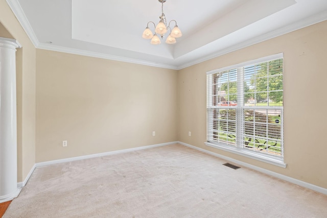 1729 Dryden Dr, Spring Hill, TN 37174 - carpeted spare room with ornate columns, a raised ceiling, a chandelier, healthy amount of natural light, and ornamental molding