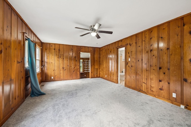 1221 W Commerce St W, Lewisburg, TN 37091 - carpeted empty room with a ceiling fan and wood walls