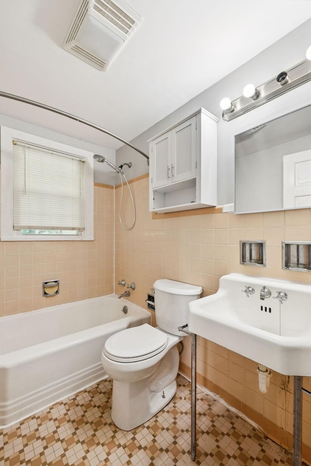 1221 W Commerce St W, Lewisburg, TN 37091 - full bath featuring tile walls and washtub / shower combination