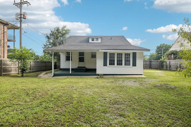 1221 W Commerce St W, Lewisburg, TN 37091 - back of property with a fenced backyard, a patio area, and roof with shingles