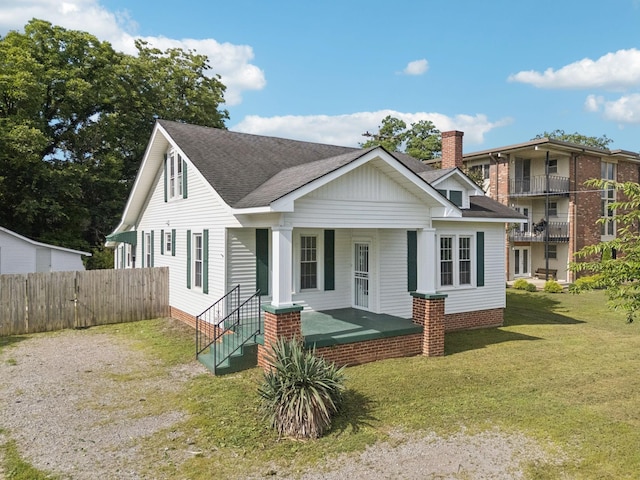 1221 W Commerce St W, Lewisburg, TN 37091 - view of front of home with covered porch, roof with shingles, and a chimney
