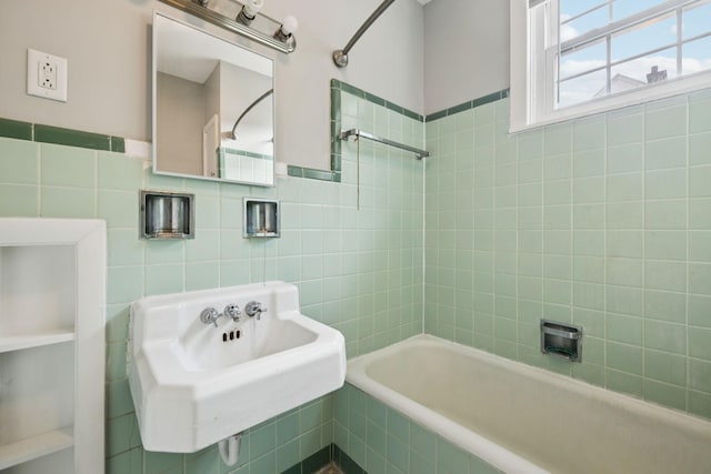 1221 W Commerce St W, Lewisburg, TN 37091 - bathroom featuring tile walls, tiled shower / bath combo, and wainscoting