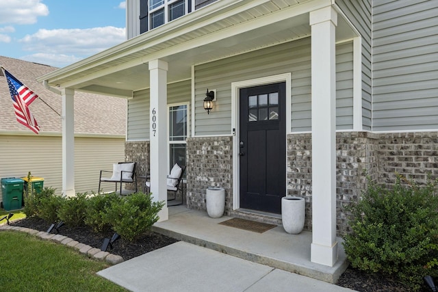 6007 Cavalry Ct, Spring Hill, TN 37174 - property entrance featuring a porch and stone siding