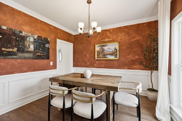 6007 Cavalry Ct, Spring Hill, TN 37174 - dining area featuring a chandelier, wainscoting, wood finished floors, ornamental molding, and a decorative wall