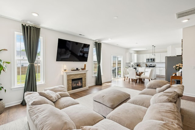 6007 Cavalry Ct, Spring Hill, TN 37174 - living area with a fireplace, light wood-style floors, and recessed lighting