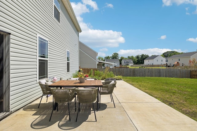 6007 Cavalry Ct, Spring Hill, TN 37174 - fenced backyard featuring a patio, outdoor dining area, and a residential view