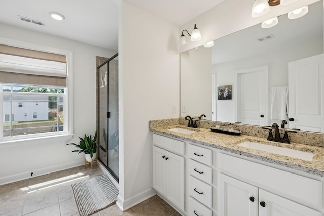 6007 Cavalry Ct, Spring Hill, TN 37174 - bathroom with double vanity, a shower stall, and tile patterned flooring