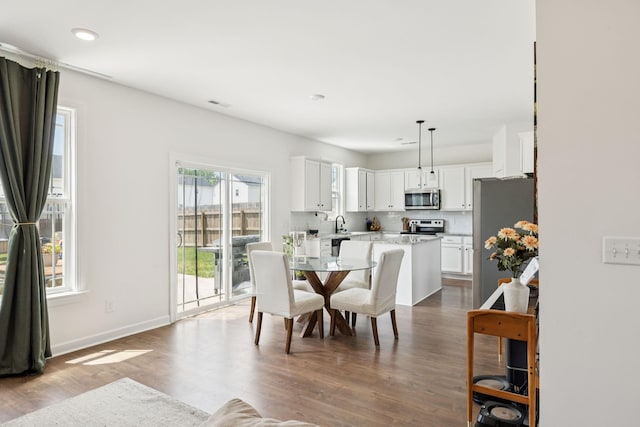 6007 Cavalry Ct, Spring Hill, TN 37174 - dining area with dark wood-type flooring and recessed lighting
