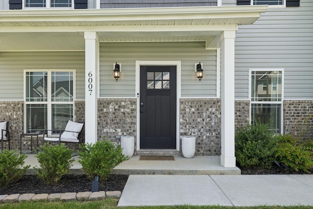 6007 Cavalry Ct, Spring Hill, TN 37174 - view of exterior entry with a porch and stone siding
