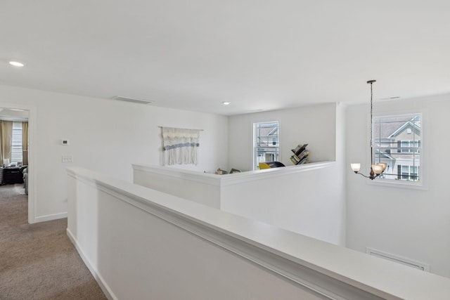 6007 Cavalry Ct, Spring Hill, TN 37174 - corridor featuring an upstairs landing, carpet floors, plenty of natural light, recessed lighting, and a chandelier