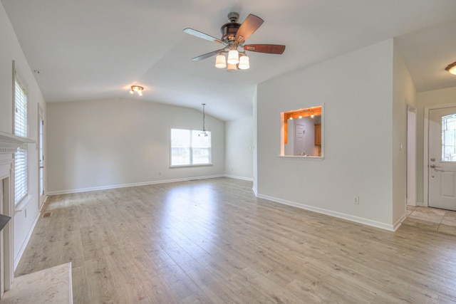 2902 Crenshaw Ct, Spring Hill, TN 37174 - unfurnished living room featuring light wood-style floors, ceiling fan, lofted ceiling, and a fireplace with flush hearth
