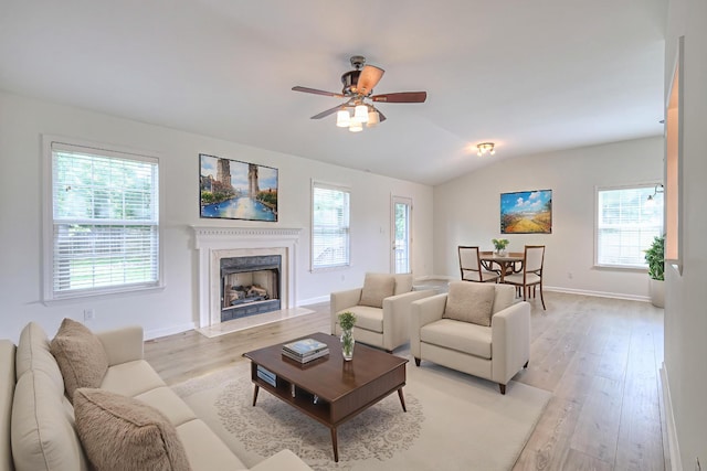 2902 Crenshaw Ct, Spring Hill, TN 37174 - living room with vaulted ceiling, light wood finished floors, a premium fireplace, and healthy amount of natural light