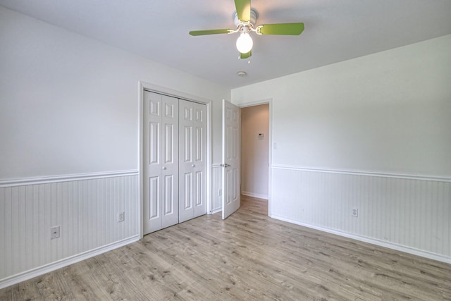 2902 Crenshaw Ct, Spring Hill, TN 37174 - unfurnished bedroom with wood finished floors, a closet, a wainscoted wall, and a ceiling fan