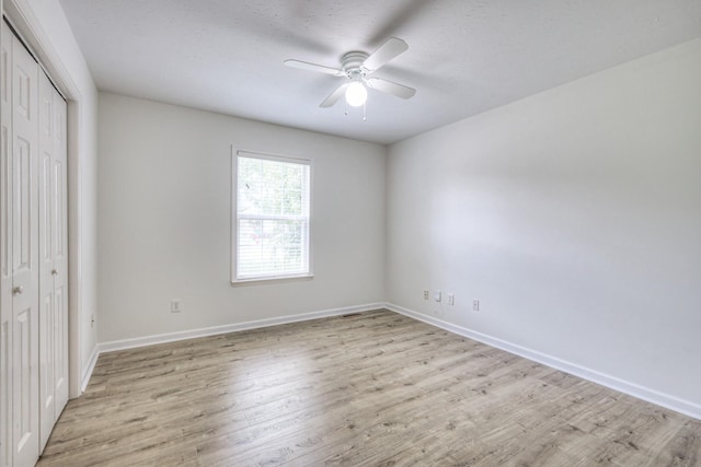 2902 Crenshaw Ct, Spring Hill, TN 37174 - unfurnished bedroom with a closet, light wood-type flooring, and a ceiling fan
