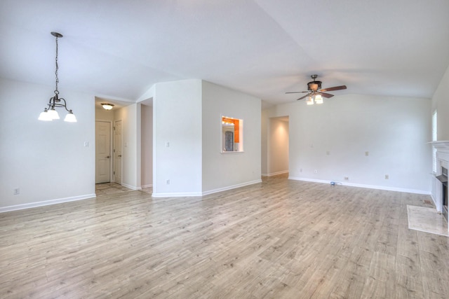 2902 Crenshaw Ct, Spring Hill, TN 37174 - unfurnished living room featuring ceiling fan, light wood-type flooring, lofted ceiling, and a fireplace with flush hearth