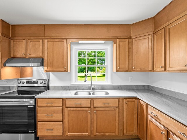 206 Elk Acre Dr, Estill Springs, TN 37330 - kitchen featuring electric range, under cabinet range hood, light countertops, and brown cabinetry