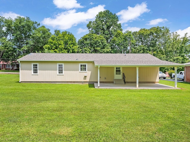 206 Elk Acre Dr, Estill Springs, TN 37330 - back of house featuring entry steps, a lawn, a carport, and a shingled roof