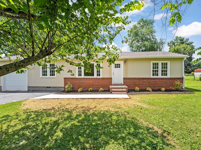 206 Elk Acre Dr, Estill Springs, TN 37330 - ranch-style home with brick siding, a front lawn, entry steps, driveway, and a garage