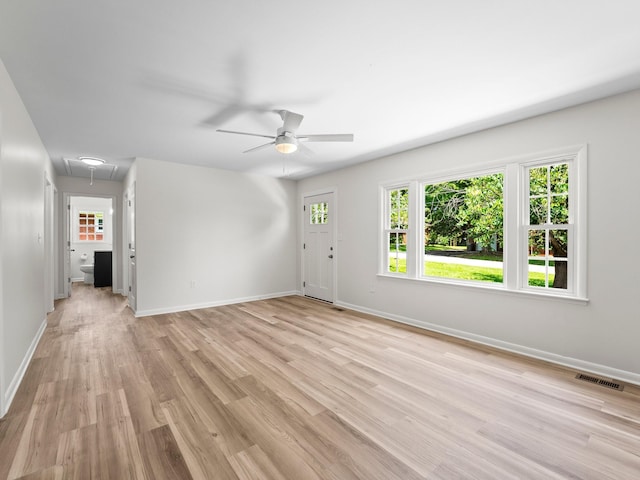 206 Elk Acre Dr, Estill Springs, TN 37330 - unfurnished living room featuring attic access, ceiling fan, light wood finished floors, and healthy amount of natural light