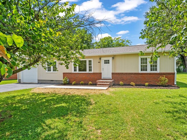 206 Elk Acre Dr, Estill Springs, TN 37330 - view of front of property featuring brick siding, asphalt driveway, a front yard, entry steps, and a garage
