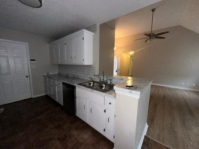 4073 Challis Dr, Clarksville, TN 37040 - kitchen with black dishwasher, a peninsula, a ceiling fan, white cabinetry, and light countertops