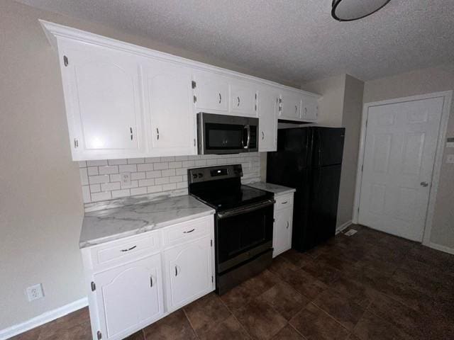 4073 Challis Dr, Clarksville, TN 37040 - kitchen featuring stainless steel appliances, a textured ceiling, white cabinets, and decorative backsplash