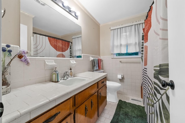 305 Barry Dr, Clarksville, TN 37040 - bathroom with crown molding, vanity, tile patterned flooring, tile walls, and a wainscoted wall