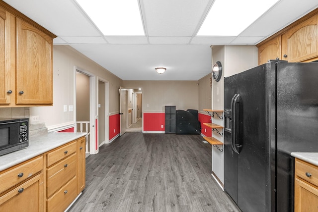 305 Barry Dr, Clarksville, TN 37040 - kitchen featuring black appliances, light wood-style flooring, and light countertops