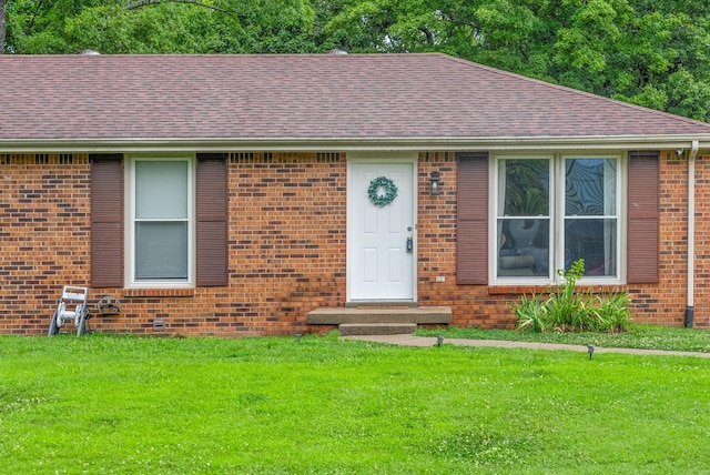 305 Barry Dr, Clarksville, TN 37040 - view of front of house with roof with shingles, a front lawn, and brick siding