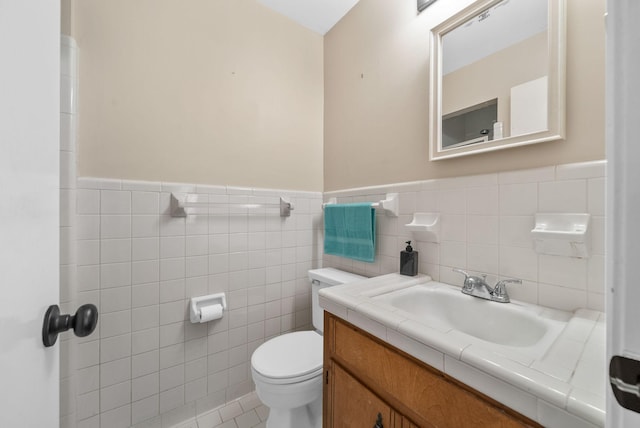 305 Barry Dr, Clarksville, TN 37040 - bathroom featuring wainscoting, tile walls, vanity, and tile patterned flooring