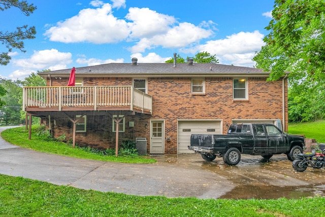 305 Barry Dr, Clarksville, TN 37040 - rear view of property featuring brick siding, a deck, an attached garage, and driveway