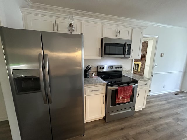 2519 Buckle St, Murfreesboro, TN 37129 - kitchen with appliances with stainless steel finishes, crown molding, white cabinets, dark wood finished floors, and light stone countertops