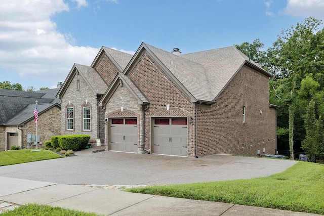 2229 Arbor Pointe Way, Hermitage, TN 37076 - view of front of property featuring a chimney, concrete driveway, brick siding, and an attached garage