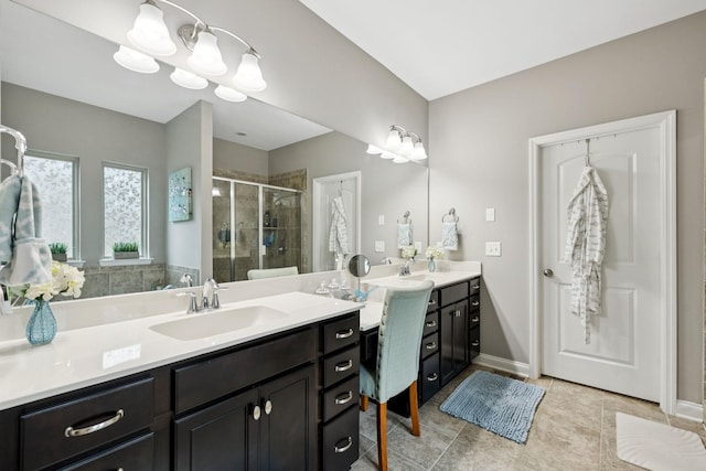 2229 Arbor Pointe Way, Hermitage, TN 37076 - bathroom featuring a stall shower, two vanities, tile patterned floors, and a chandelier