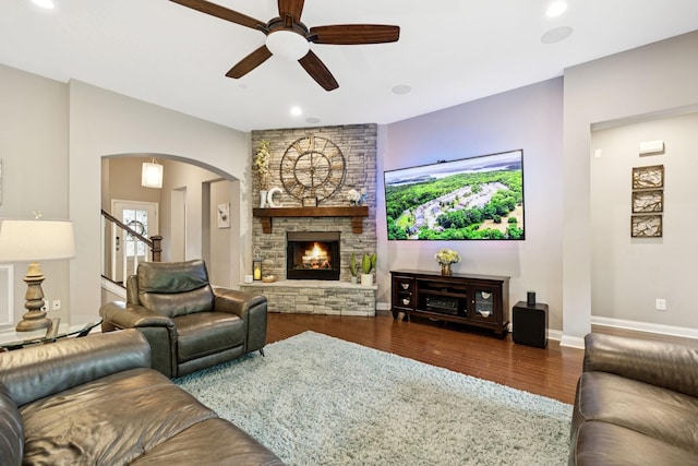2229 Arbor Pointe Way, Hermitage, TN 37076 - living area featuring ceiling fan, wood finished floors, arched walkways, recessed lighting, and a stone fireplace