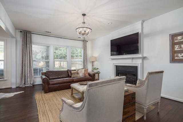 5925 Westheimer Dr, Brentwood, TN 37027 - living room featuring a fireplace, a chandelier, and wood finished floors