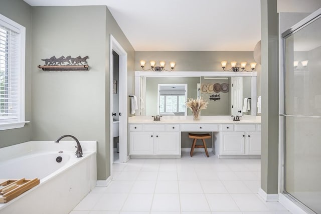 5925 Westheimer Dr, Brentwood, TN 37027 - full bathroom with double vanity, a bath, a stall shower, and a chandelier