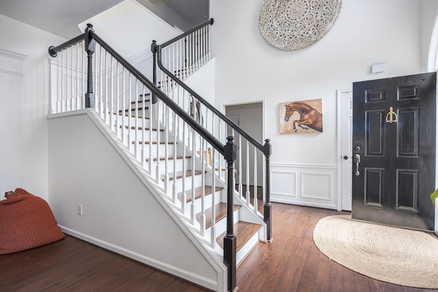 5925 Westheimer Dr, Brentwood, TN 37027 - foyer entrance featuring wood finished floors, a high ceiling, stairs, and wainscoting