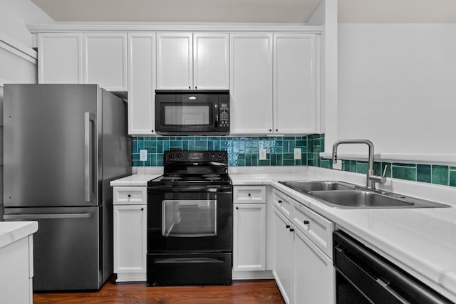 8441 Callabee Way # 14, Antioch, TN 37013 - kitchen with black appliances, white cabinets, tasteful backsplash, and light countertops
