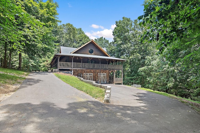1455 Shell Rd, Goodlettsville, TN 37072 - view of front facade with asphalt driveway, a porch, and an attached garage