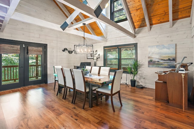 1455 Shell Rd, Goodlettsville, TN 37072 - dining space with wood walls, wood finished floors, high vaulted ceiling, a chandelier, and french doors