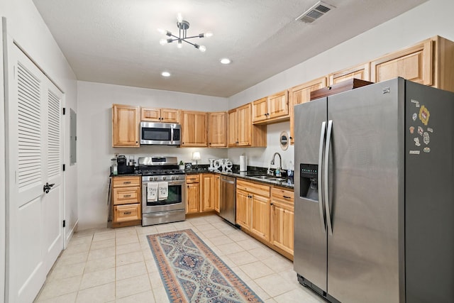 1455 Shell Rd, Goodlettsville, TN 37072 - kitchen with appliances with stainless steel finishes, a chandelier, recessed lighting, light tile patterned floors, and light brown cabinets