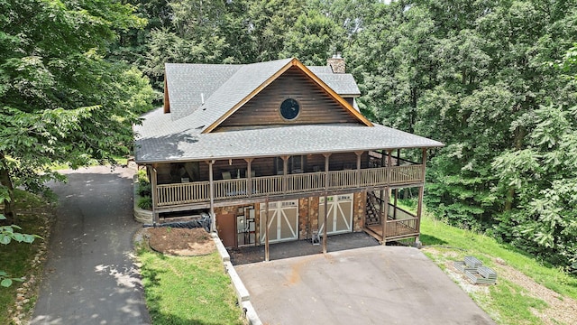 1455 Shell Rd, Goodlettsville, TN 37072 - view of front facade featuring a shingled roof, a chimney, and stairway