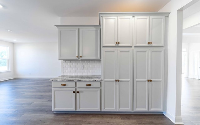 7938 Pine St, Fairview, TN 37062 - kitchen with dark wood-style floors, backsplash, and light stone counters