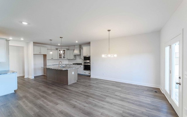 7938 Pine St, Fairview, TN 37062 - kitchen with custom range hood, plenty of natural light, tasteful backsplash, recessed lighting, and a kitchen island with sink